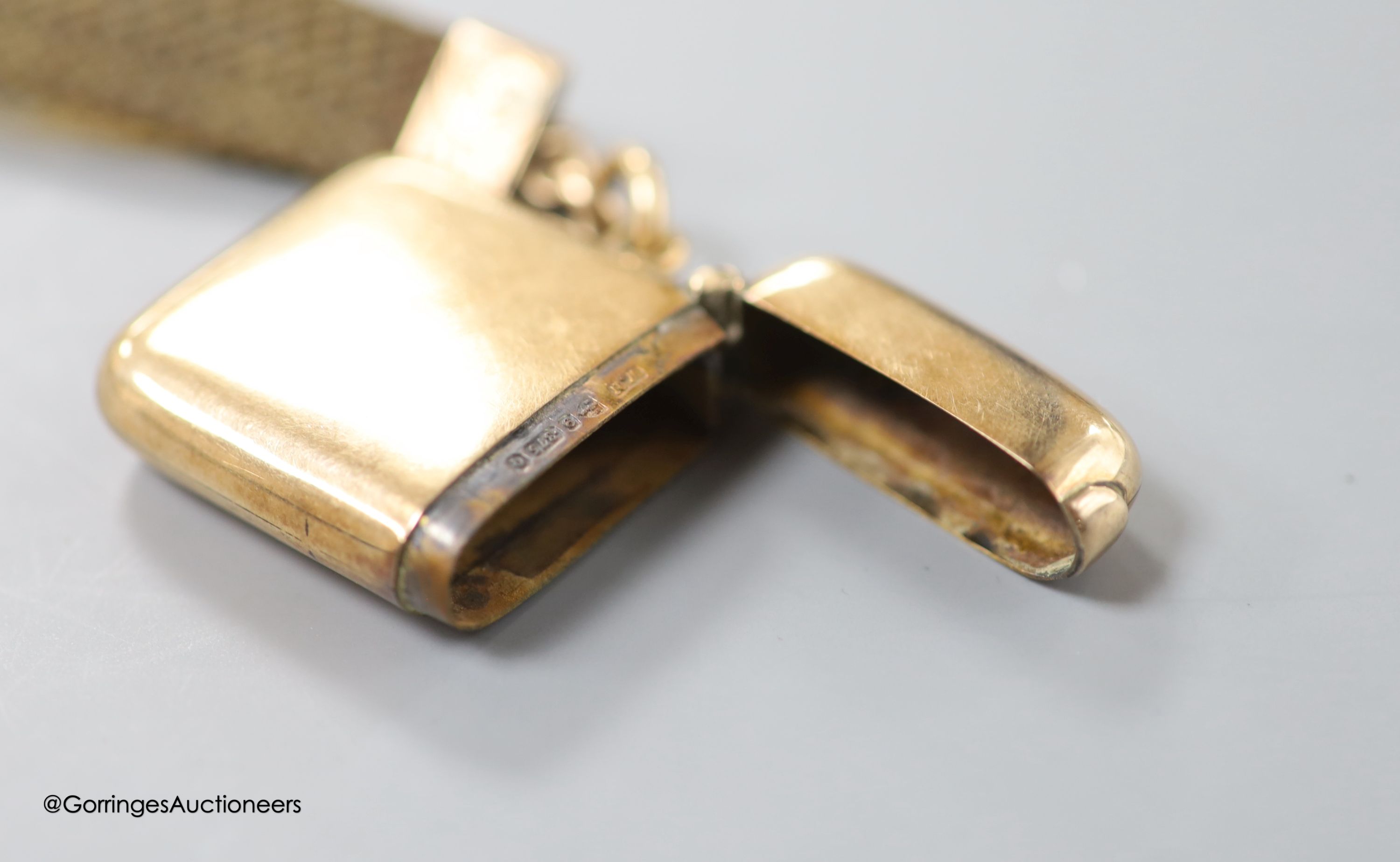 A late Victorian 9ct gold vesta case, William Neale, Chester, 1899, 40mm, with two hair mounted fobs